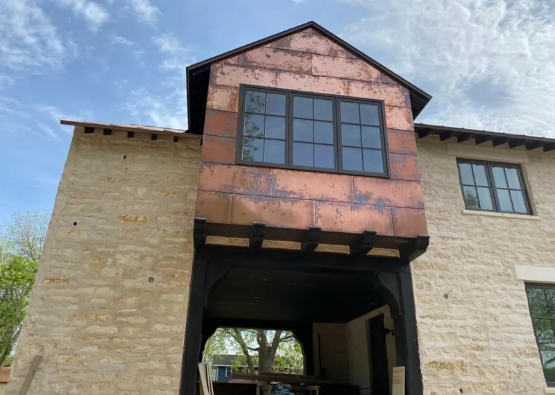 Copper metal panel facade on a stone building for Metal Roof Coating in Alta Sierra