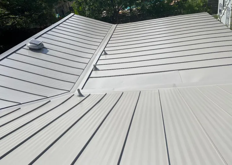 Solar attic fan installed on a metal roof for Roof Ventilation in Alta Sierra
